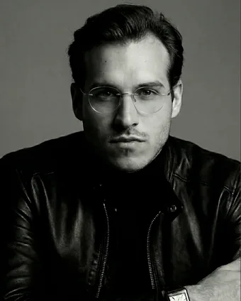 Vladimir Klepic wearing glasses and a leather jacket